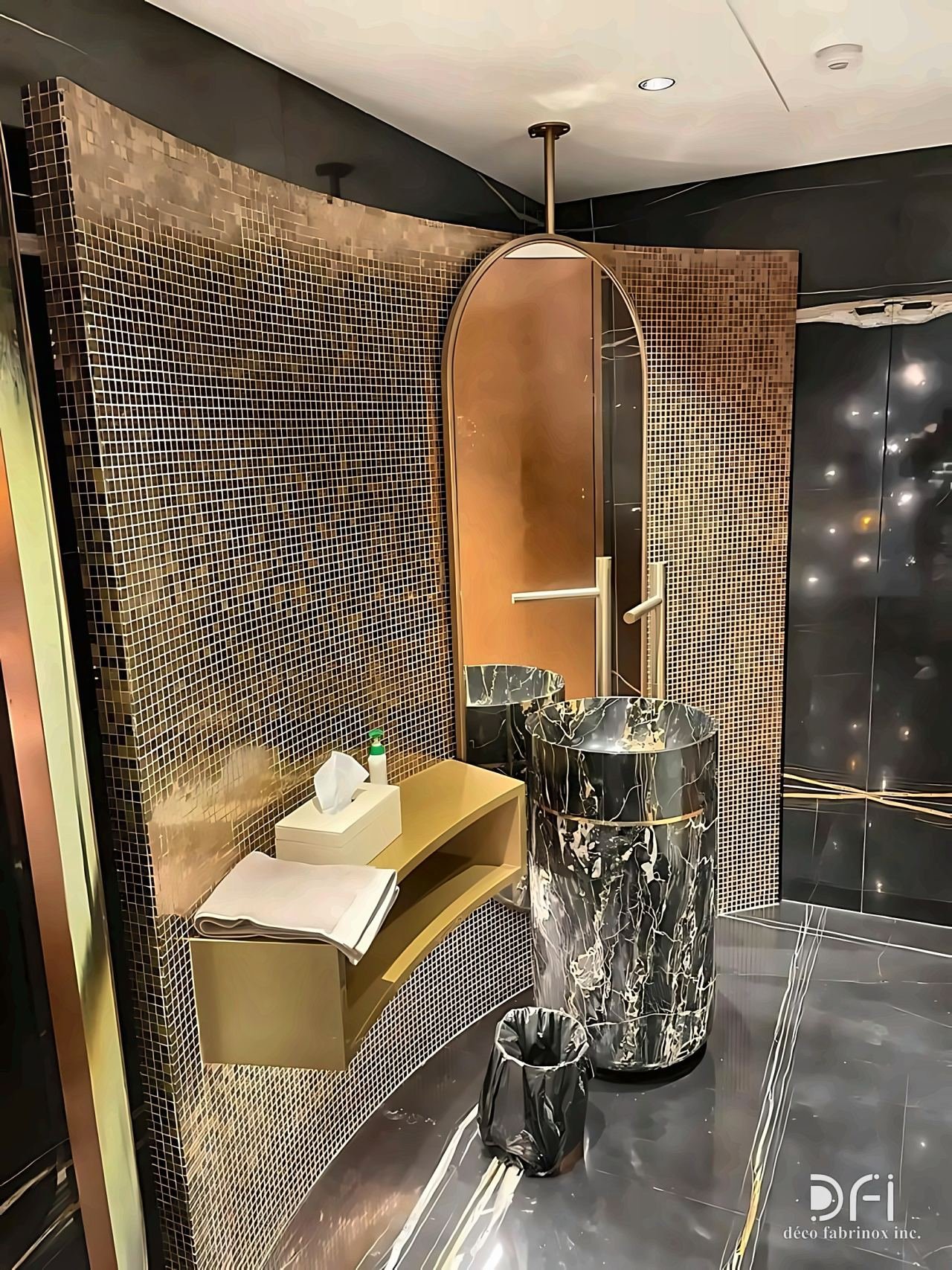 Curved mosaic wall with a brass mirror frame and floating vanity