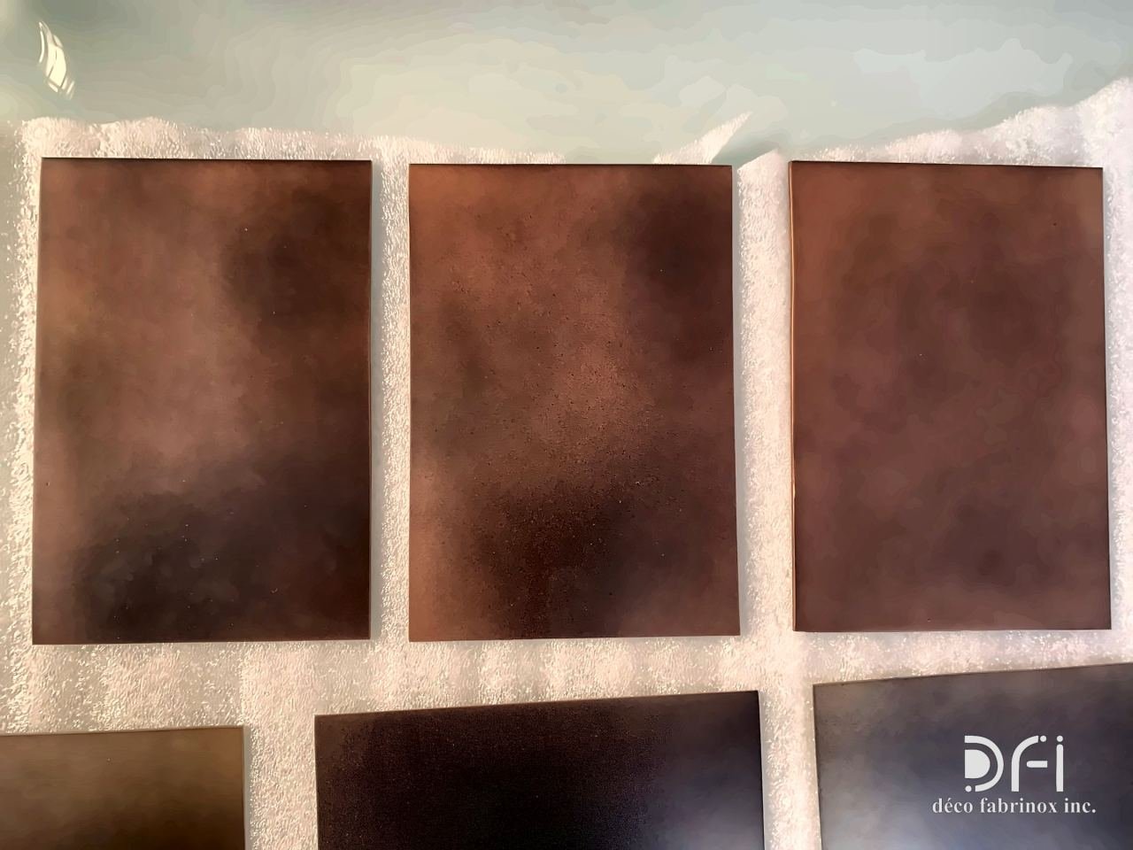 Row of smoky copper-brown finish samples